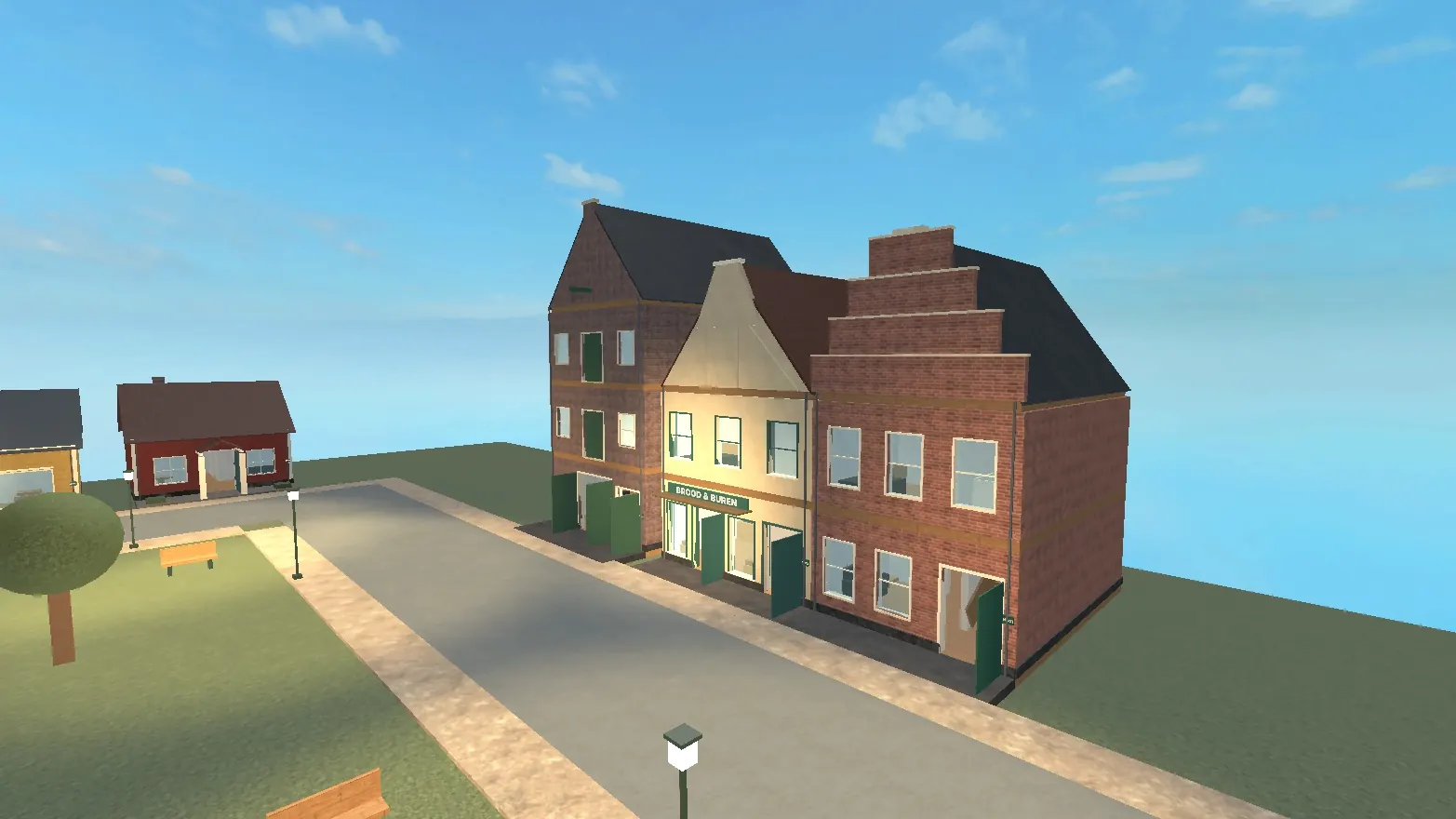 Een rij Hollandse bakstenen huizen met trapgevels langs een straat met lantaarns en bomen
